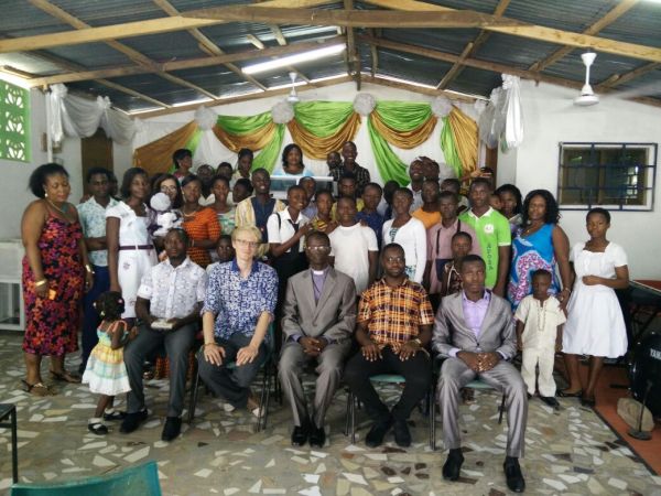 The Whole Team at the Church in a Group Photo with a Section of the Church Congregation