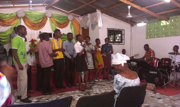 Participants and Team Leaders Ministering a Song at Church
